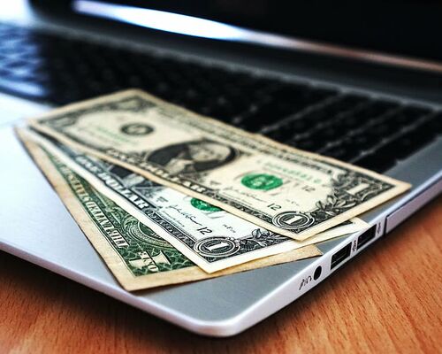 computer-buy-money-banknotes
